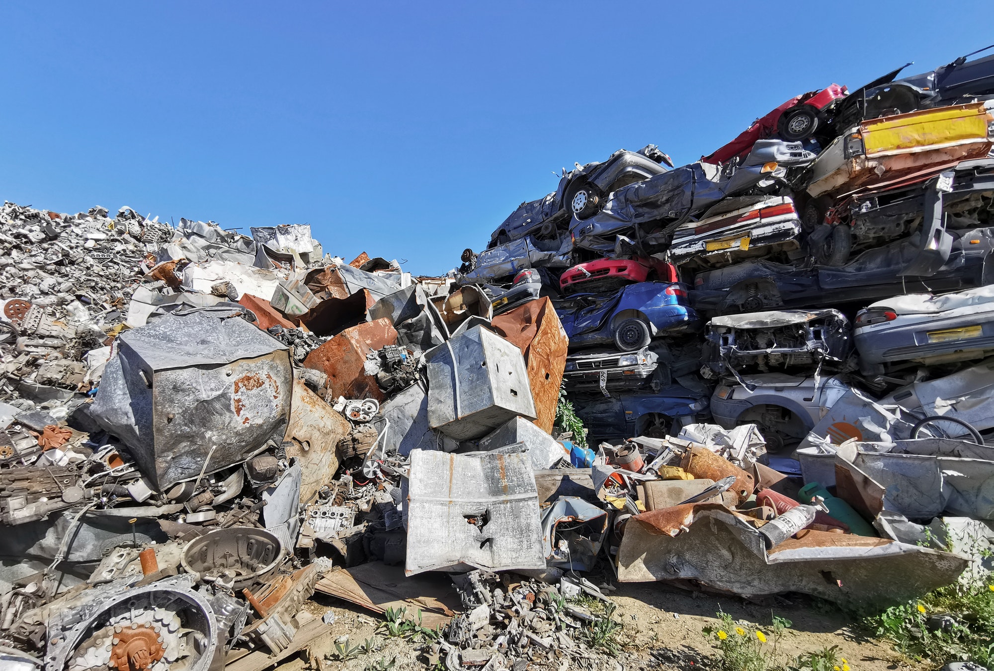 Junk Cars No Title or Registration Pile of scrap cars and other metals on a junk yard ready recycling industry.